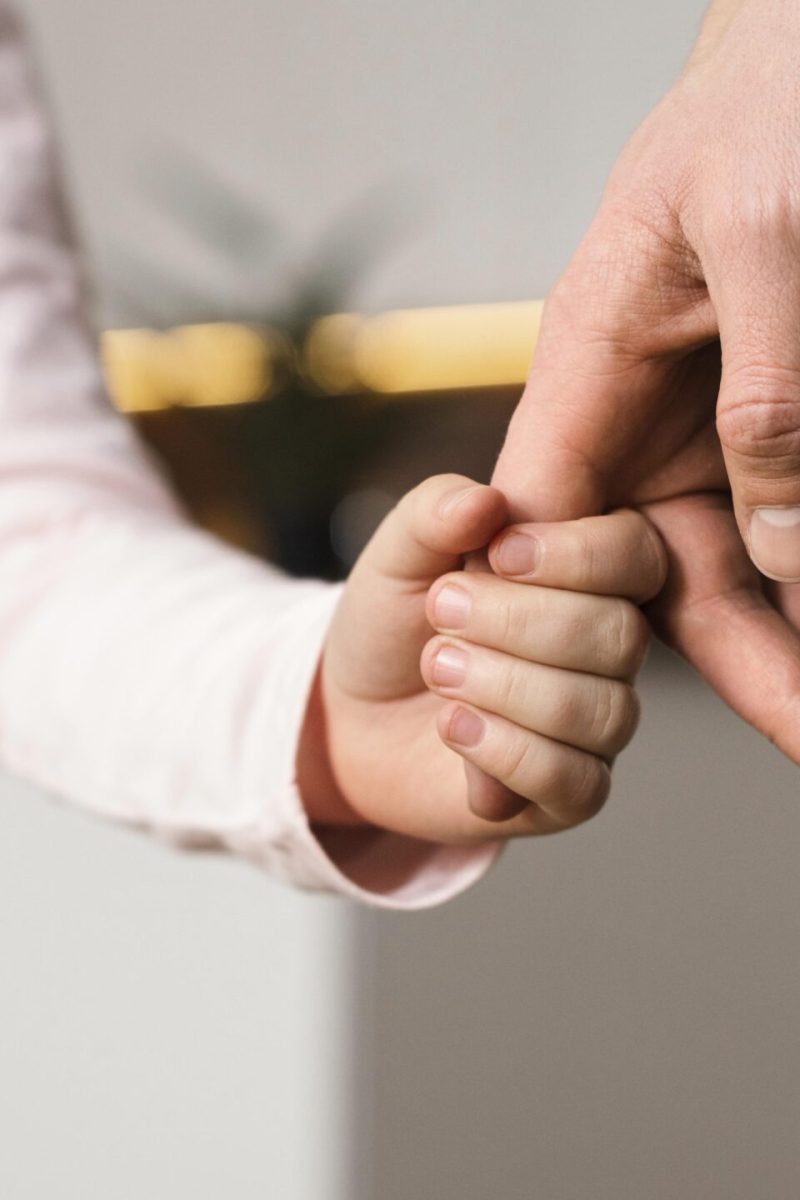 little-girl-holding-hands-with-father